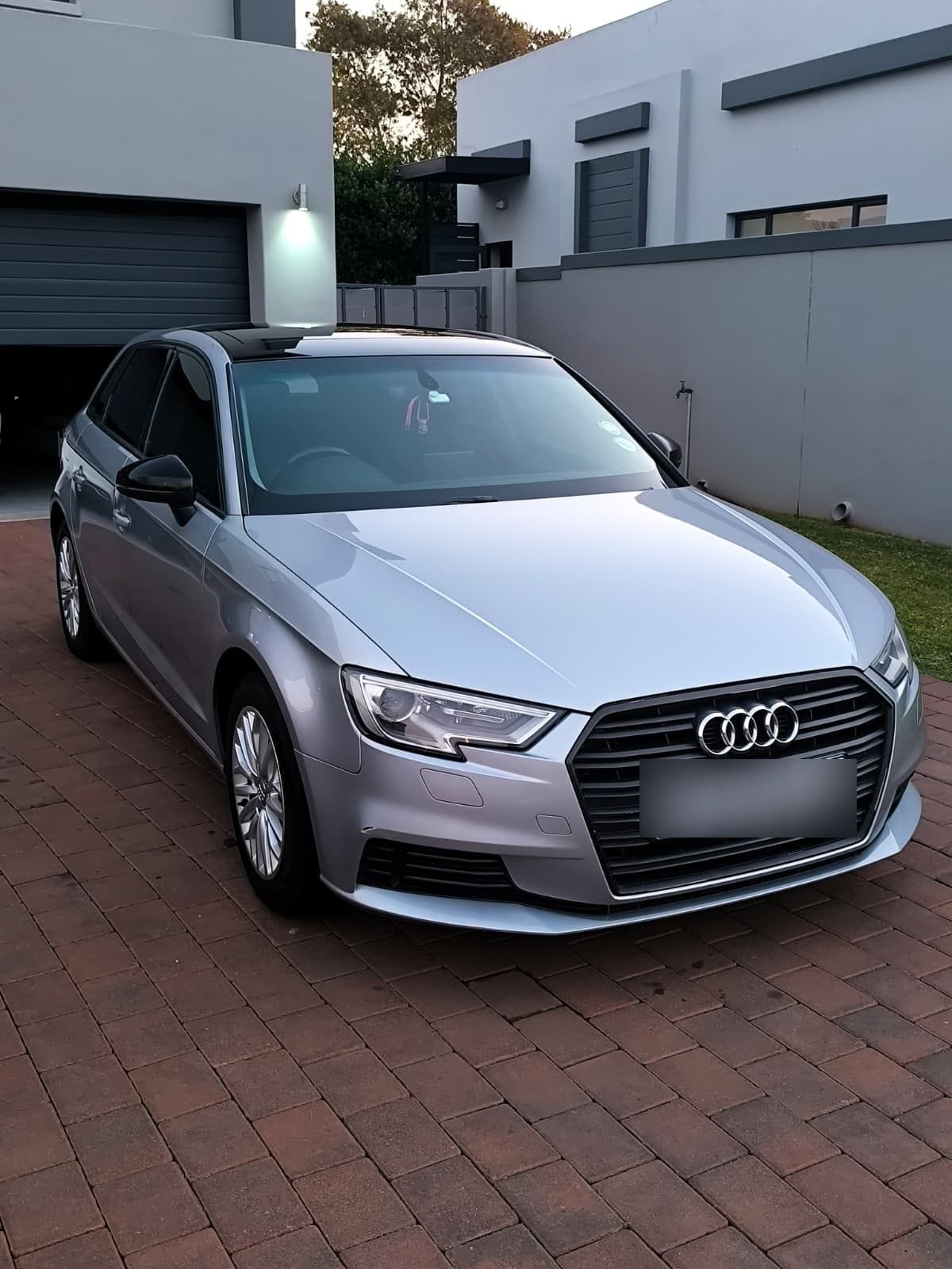 Silver Audi A3 Sportback finished at dusk on a Johannesburg driveway, paintwork sharp with reflections down the flank after a full detail
