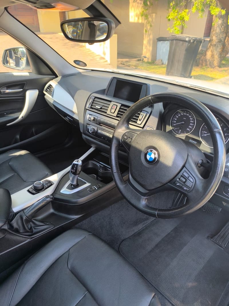 BMW 1 Series interior after a valet, dashboard, gear selector and leather seats cleaned