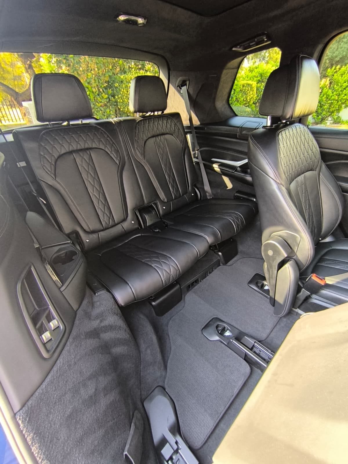 BMW X7 second row after an interior valet, quilted leather seats and carpets cleaned